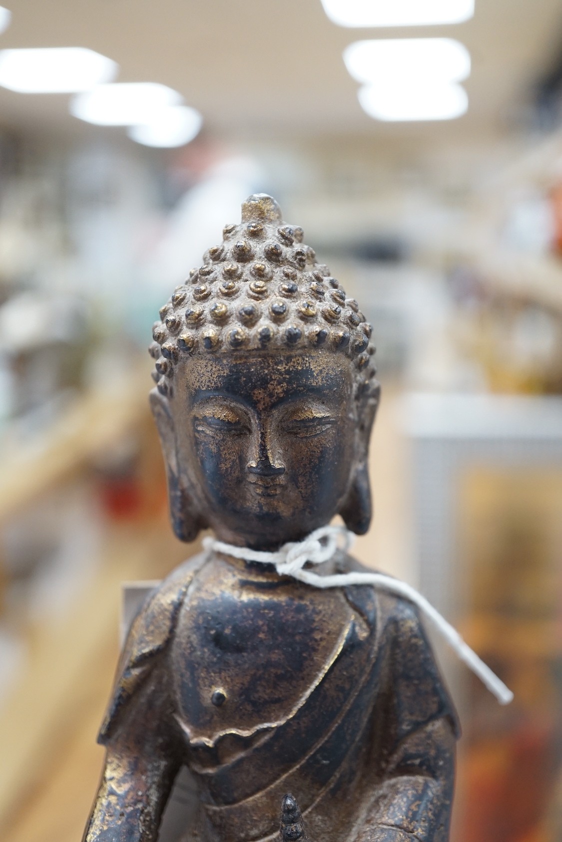 A Chinese gilt iron seated figure of Buddha, 19cm